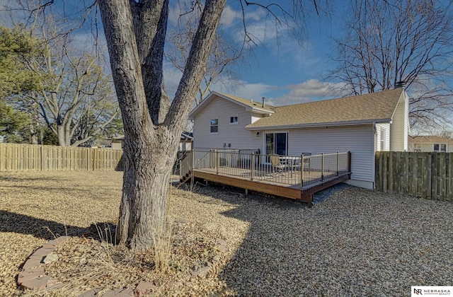 back of property featuring a deck