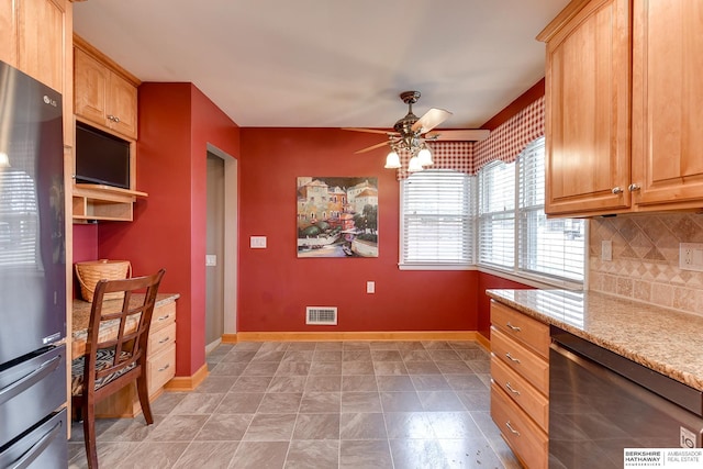 kitchen with tasteful backsplash, stainless steel refrigerator, dishwasher, ceiling fan, and light stone countertops