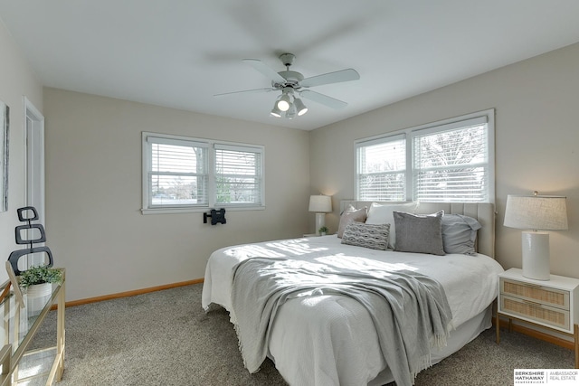 carpeted bedroom with ceiling fan and multiple windows