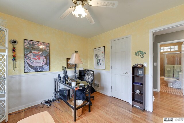 office space featuring ceiling fan and light wood-type flooring