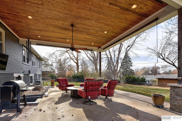 view of patio with a grill and an outdoor fire pit