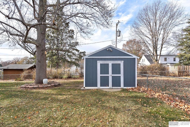 view of outbuilding with a yard