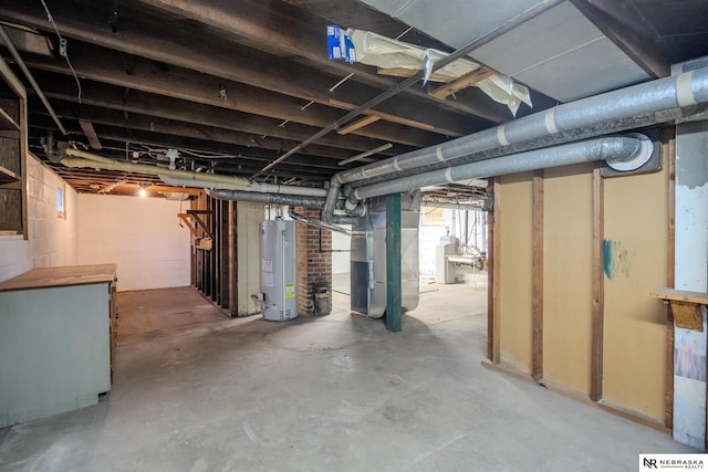 basement featuring heating unit and water heater