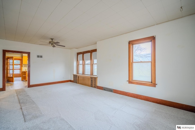 unfurnished room featuring carpet floors and ceiling fan