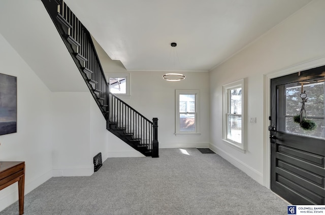 view of carpeted entrance foyer