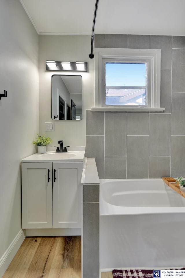 bathroom featuring vanity and hardwood / wood-style flooring