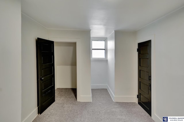 unfurnished bedroom with light carpet and ornamental molding