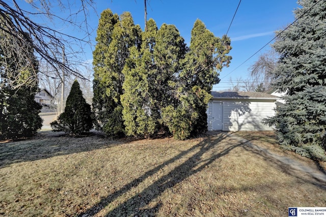 view of side of property with a lawn