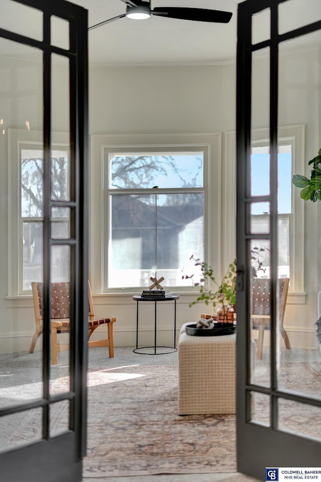 doorway featuring ceiling fan