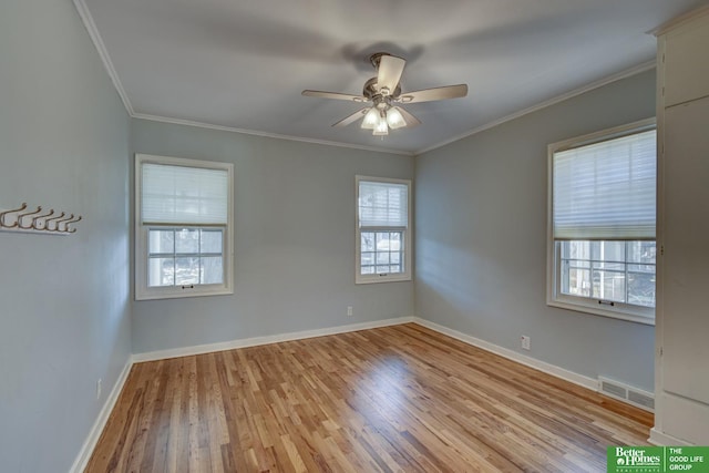 spare room featuring ceiling fan, ornamental molding, and light hardwood / wood-style floors