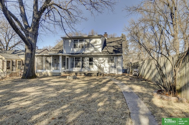 back of house with a sunroom