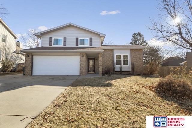 view of property with a garage and a front yard