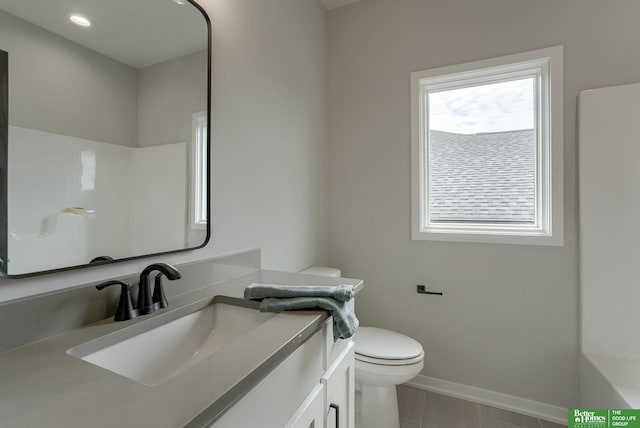 bathroom featuring vanity and toilet