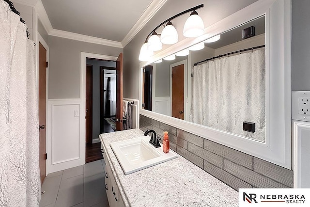 bathroom featuring vanity and crown molding