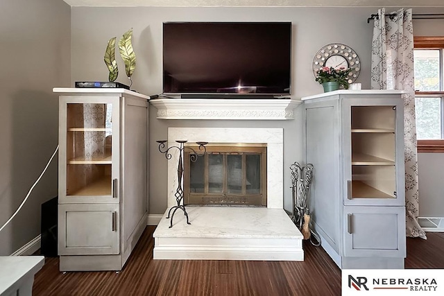 unfurnished living room featuring dark hardwood / wood-style floors