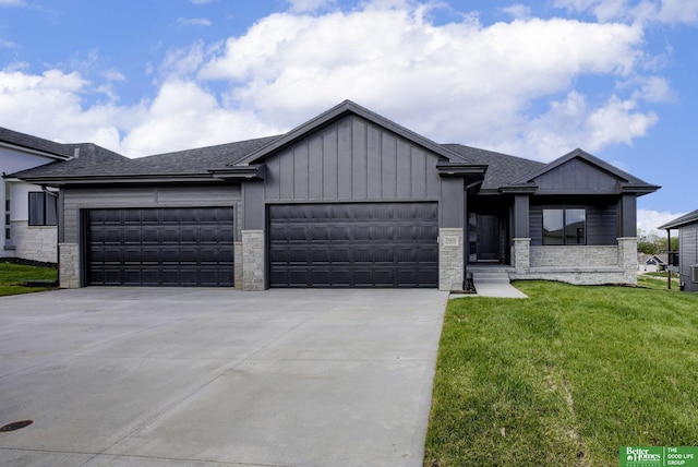 view of front of home featuring a garage and a front lawn