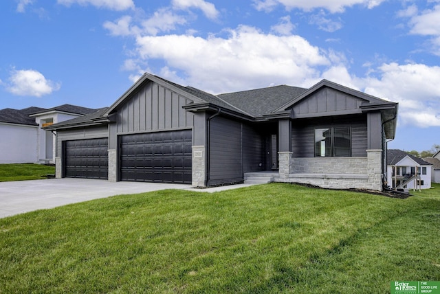 view of front facade with a garage and a front yard