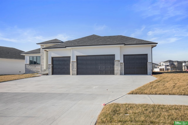 prairie-style home featuring a garage