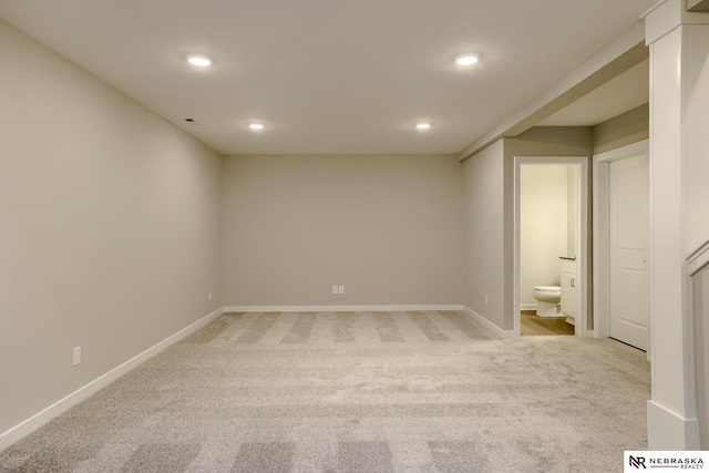 empty room with light colored carpet