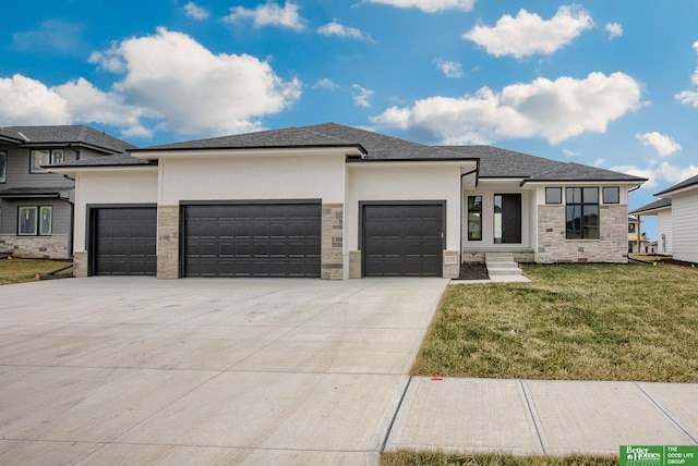 prairie-style home with a garage and a front lawn