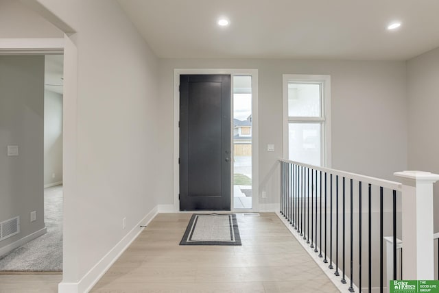 foyer with light wood-type flooring