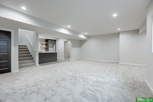 basement featuring carpet flooring