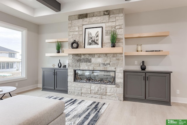 interior space featuring a fireplace and light hardwood / wood-style floors