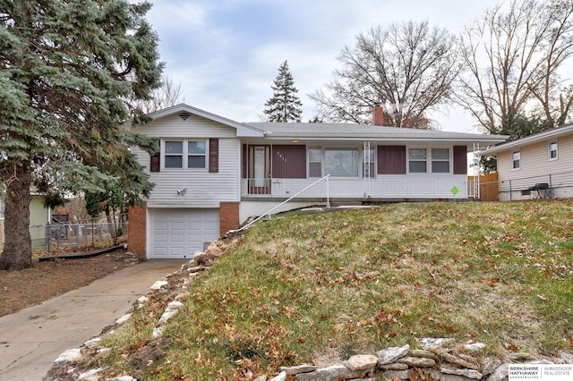 view of front of home with a garage and a front yard