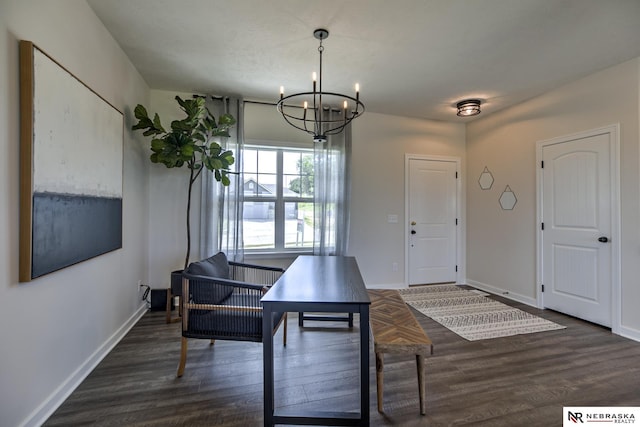 dining area featuring dark wood-type flooring and a notable chandelier