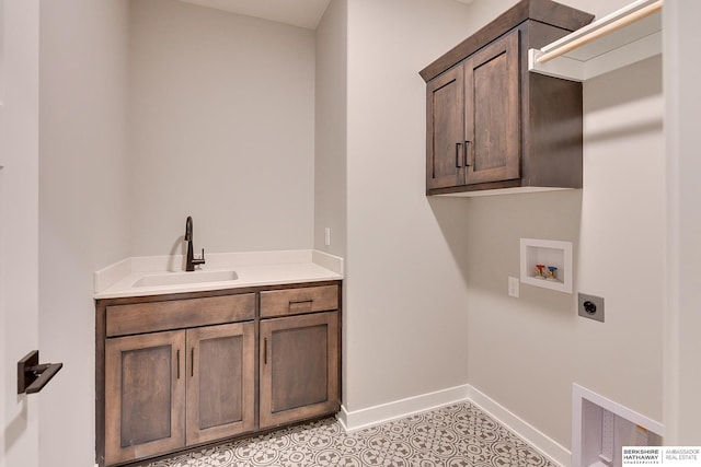 clothes washing area with sink, light tile patterned floors, hookup for a washing machine, cabinets, and hookup for an electric dryer