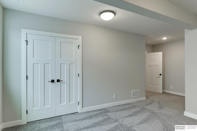 spare room with light colored carpet