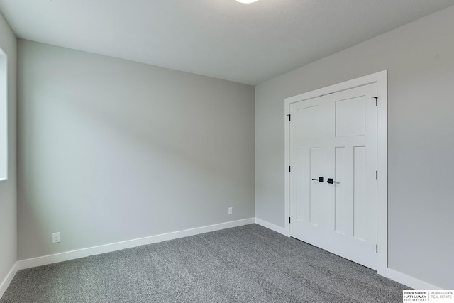 unfurnished room with carpet