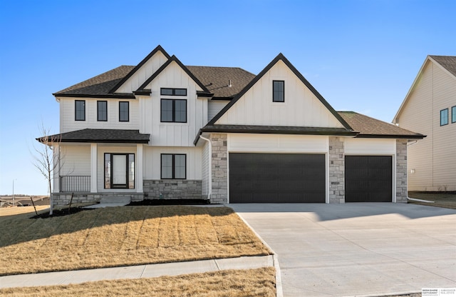 view of front of house featuring a garage and a front lawn