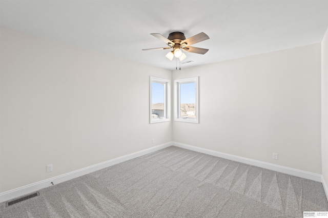 carpeted empty room with ceiling fan