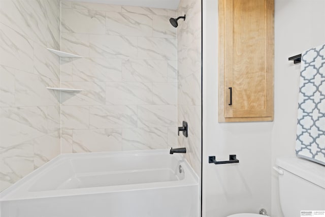 bathroom featuring toilet and tiled shower / bath combo