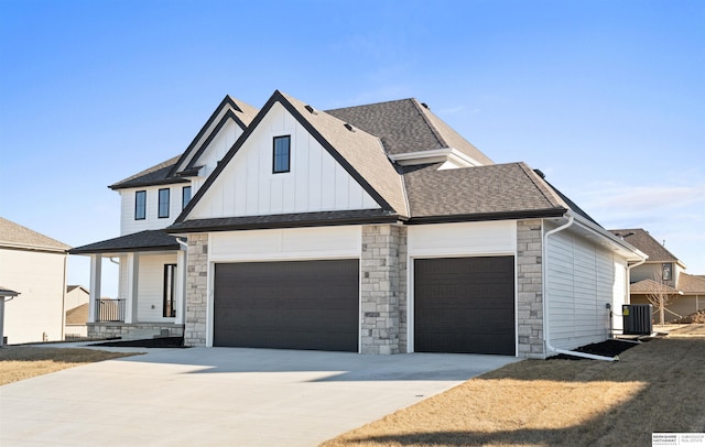 view of front of house featuring central AC unit and a garage