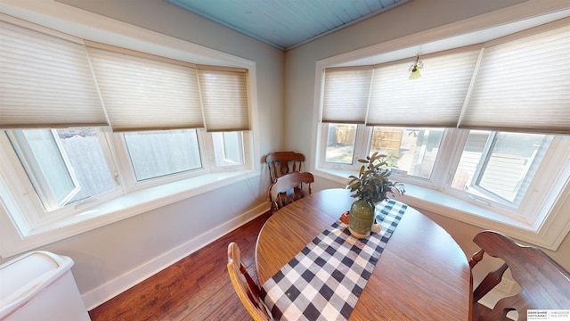 dining space featuring dark wood-type flooring