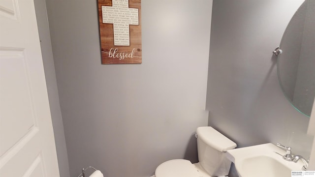 bathroom with sink and toilet