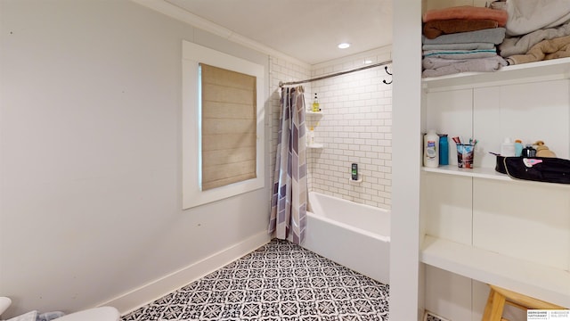 bathroom featuring shower / tub combo with curtain, toilet, and tile patterned flooring