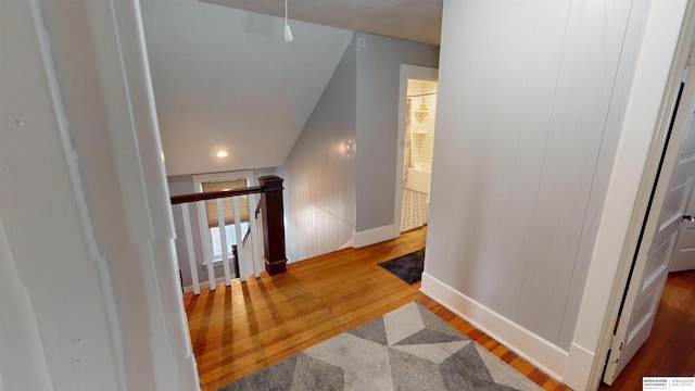 hall with hardwood / wood-style floors