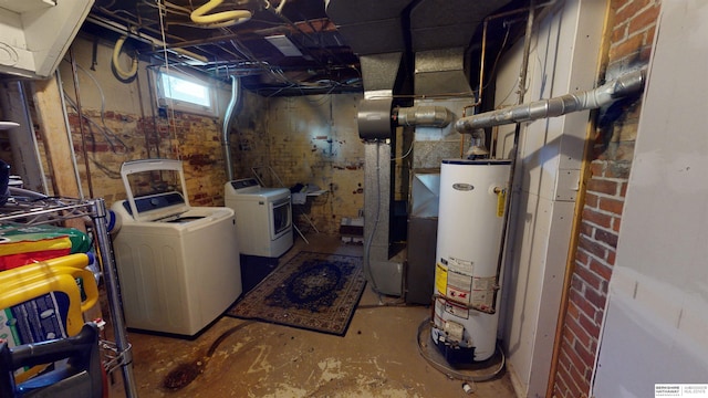 basement featuring washer and clothes dryer and gas water heater