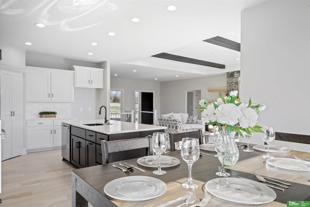 dining area with recessed lighting and light wood-style flooring