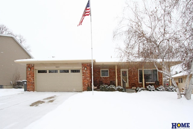 ranch-style house with brick siding and an attached garage