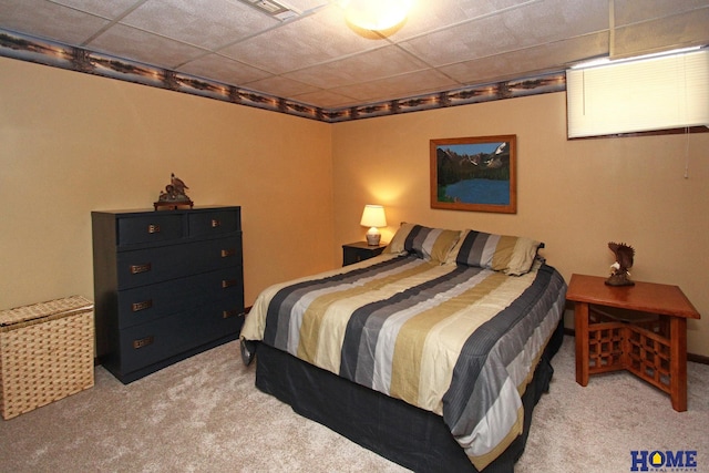 carpeted bedroom featuring visible vents