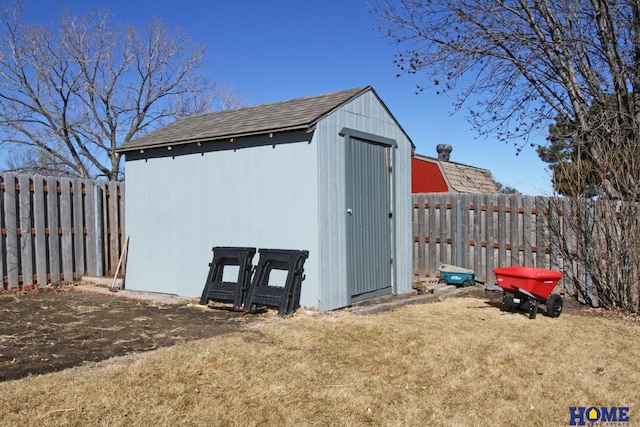 view of shed with a fenced backyard