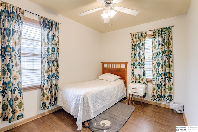 bedroom featuring dark wood-type flooring and ceiling fan