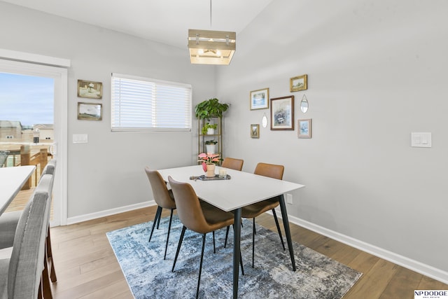 dining space featuring light wood-type flooring