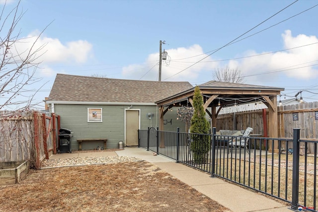 rear view of house with a patio