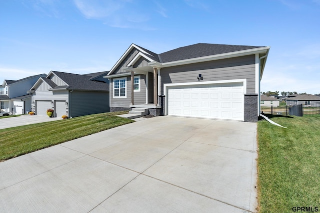 view of front of property with a garage and a front lawn