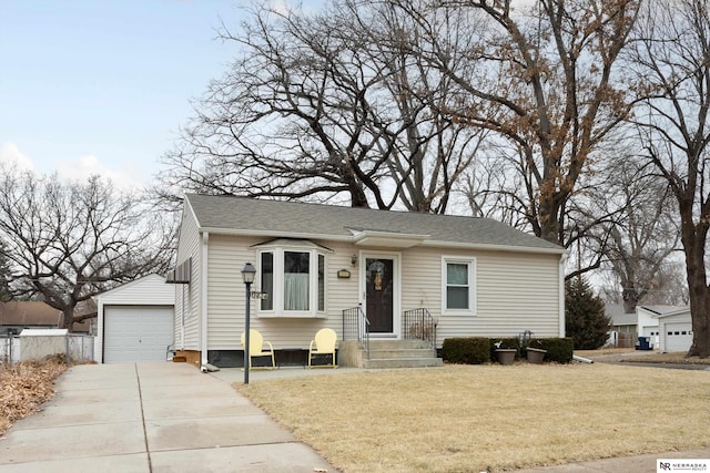 view of front of home with a garage and a front lawn